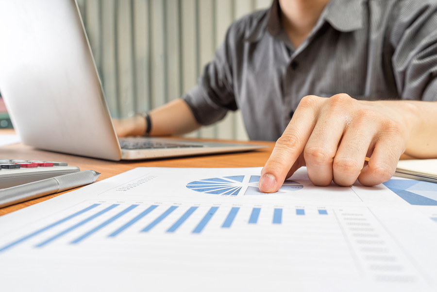 businessman analyzing investment charts Accounting and Business concept soft focus vintage tone